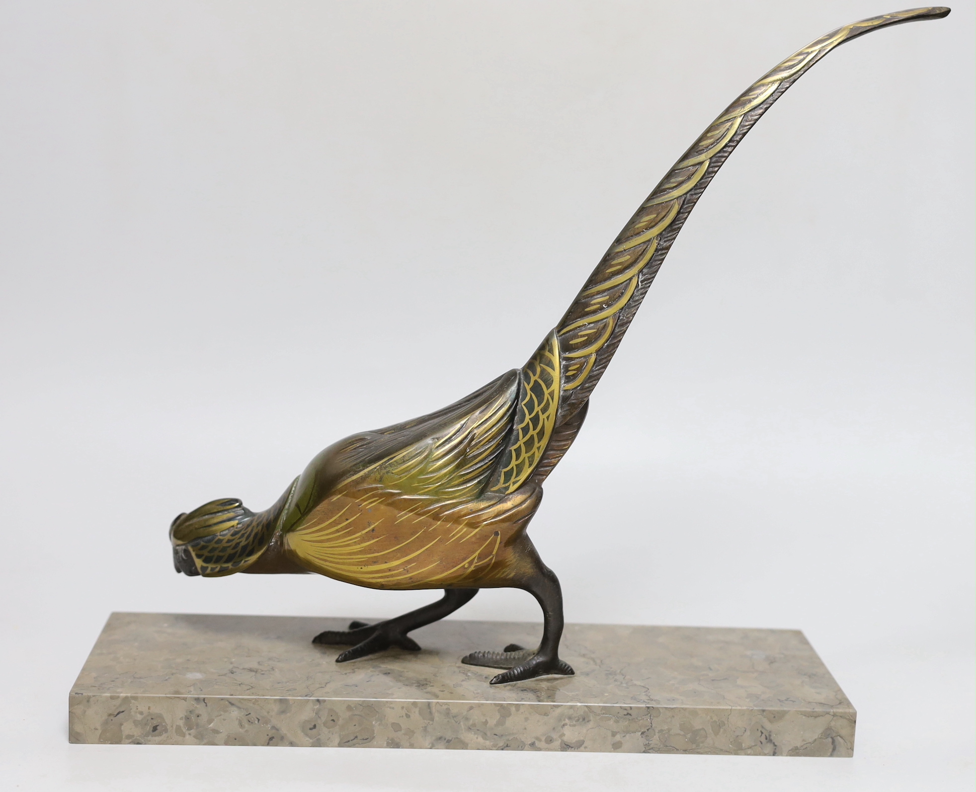 An Art Deco patinated spelter pheasant on marble base, 32cm wide, 32cm high